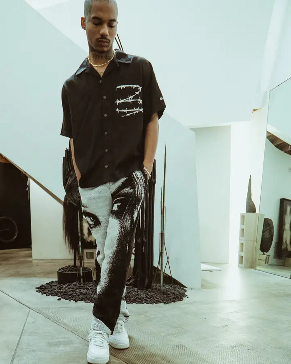 Barbed Wire Pocket Shirt (Black) worn by a model, featuring white barbed wire print across the chest pocket.