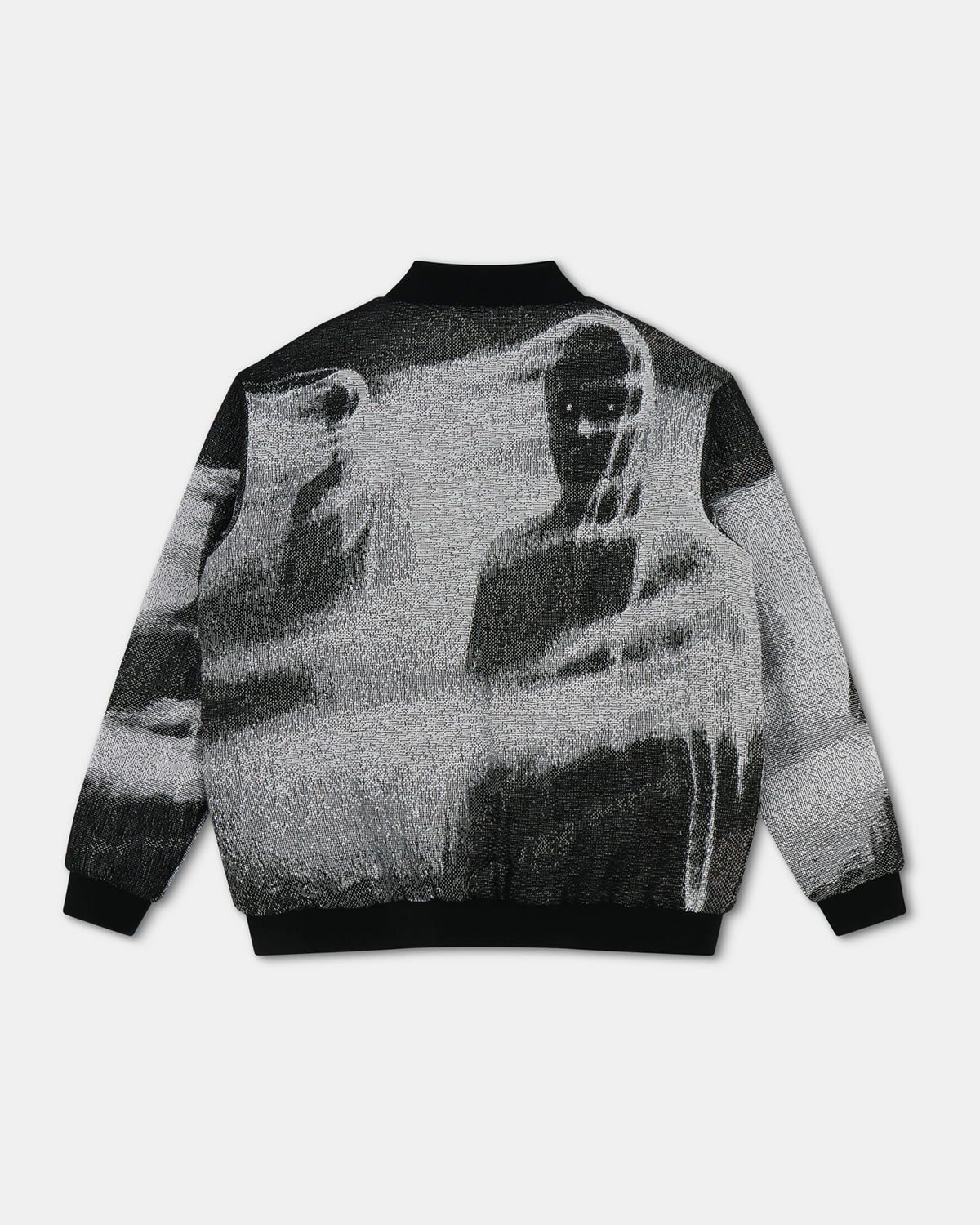 Shadow Bomber Jacket - black and white woven tapestry bomber jacket with black ribbed collar, cuffs, and hem, featuring a graphic of shadowy figures on the back