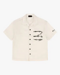 Barbed Wire Pocket Shirt (Ivory), flat product shot of a short-sleeve shirt with a black barbed wire chest pocket print.