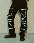 Barbed Wire Carpenter Jeans - black carpenter pants with white barbed wire graphic printed along the legs and double knee area, featuring carpenter loop detailing