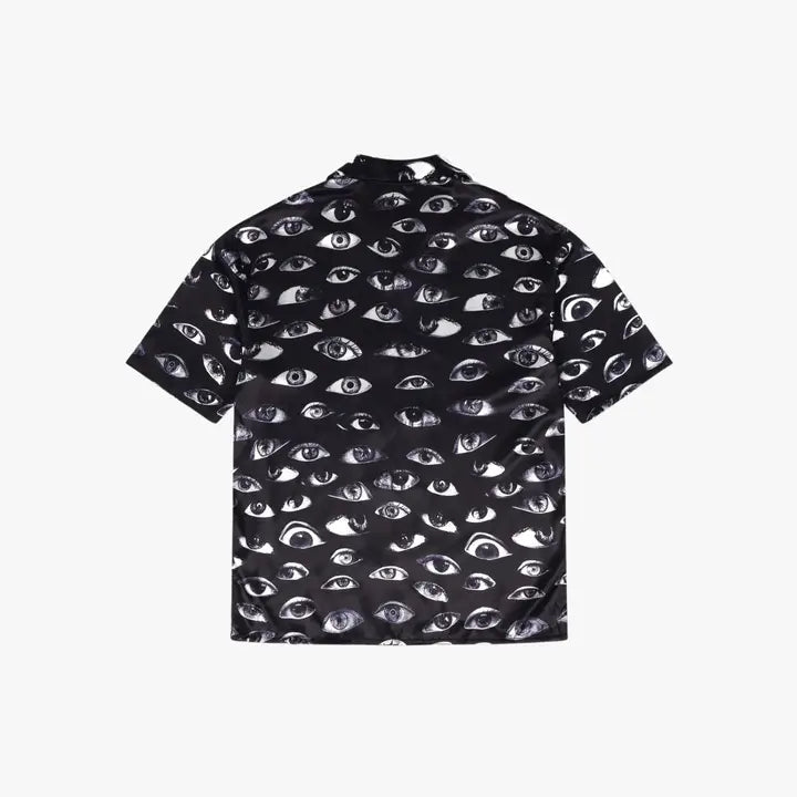 Paranoid Short Sleeve Button Up, flat product shot showing the back of a black shirt with an all-over eye pattern.