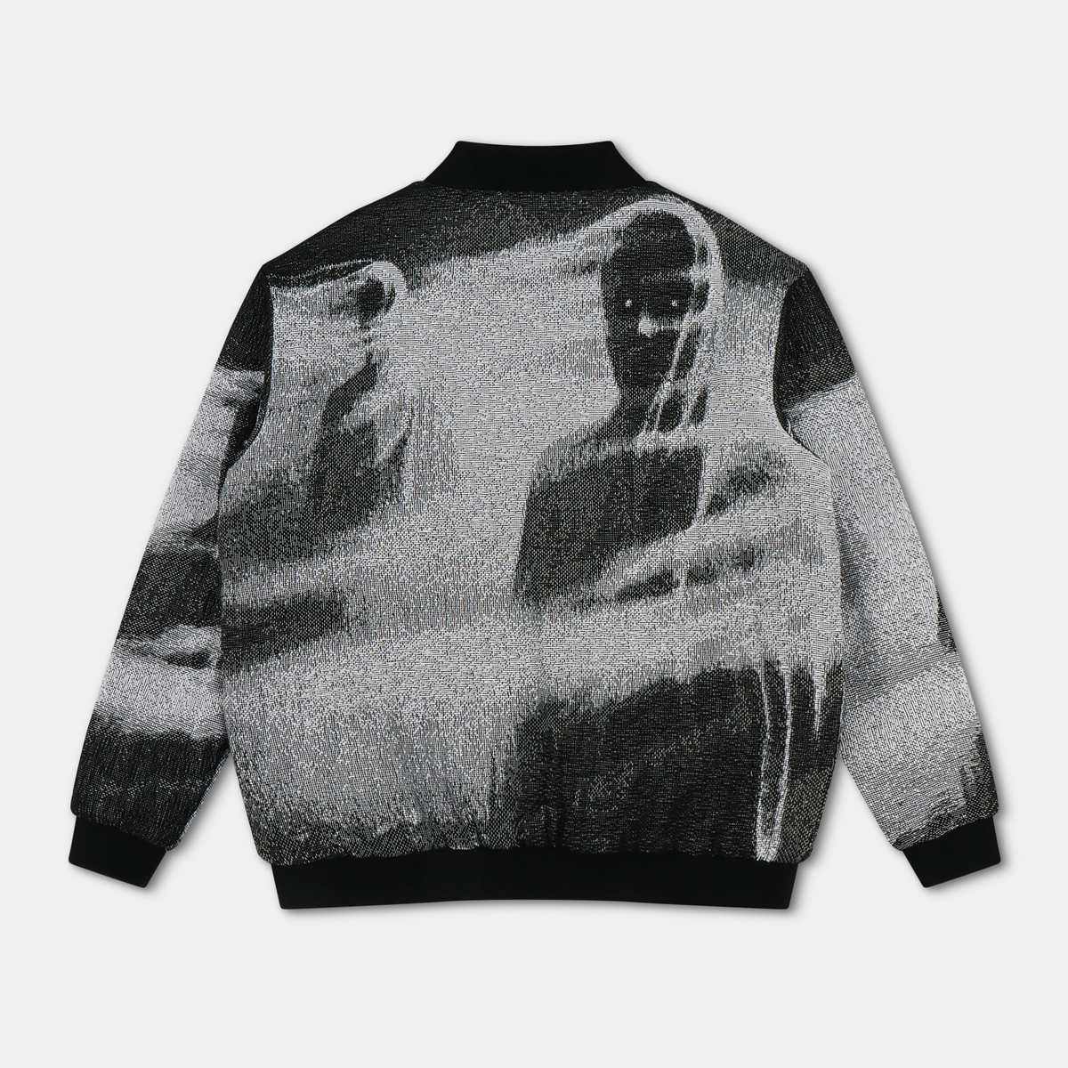 Shadow Bomber Jacket - black and white woven tapestry bomber jacket with black ribbed collar, cuffs, and hem, featuring a graphic of shadowy figures on the back